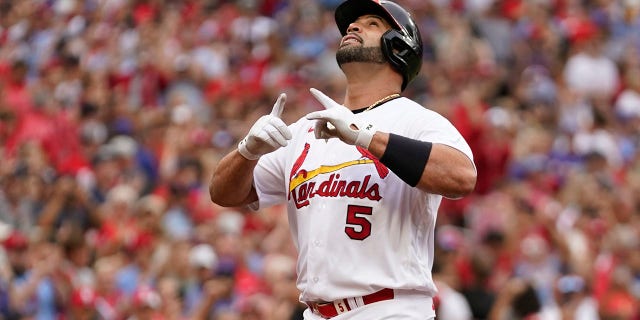 St. Louis Cardinals' Albert Pujols celebrates after hitting a two-run home run during the eighth inning against the Chicago Cubs on Sept. 4, 2022, in St. Louis.