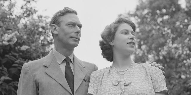King George VI and and his daughter Elizabeth in the gardens at Windsor Castle, England, July 8, 1946.