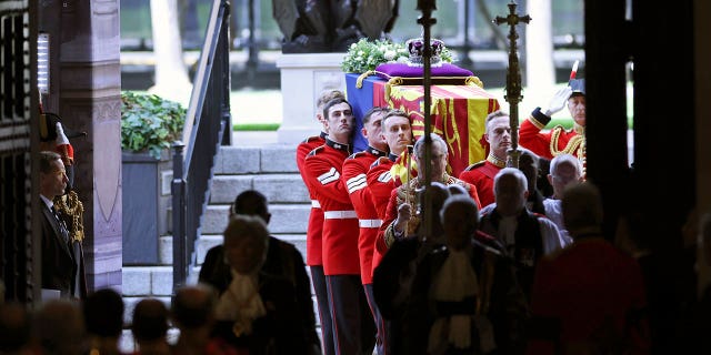 The coffin of Queen Elizabeth II is carried into Westminster Hall for the lying in State.