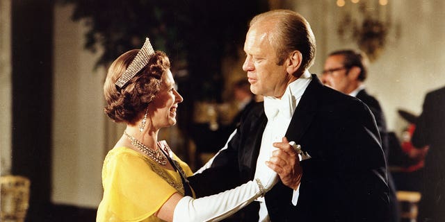 FILE – July 7, 1976: Gerald Ford dancing with Queen Elizabeth II at the ball at the White House, Washington, during the 1976 Bicentennial Celebrations of the Declaration of Independence. 