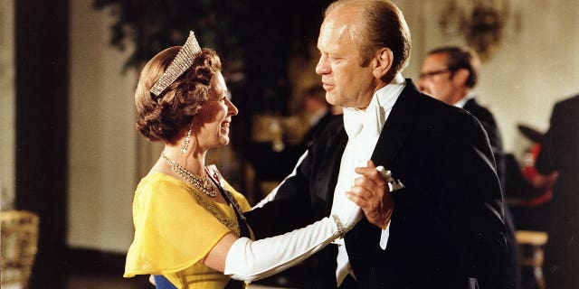 FILE – July 7, 1976: Gerald Ford dancing with Queen Elizabeth II at the ball at the White House, Washington, during the 1976 Bicentennial Celebrations of the Declaration of Independence. 