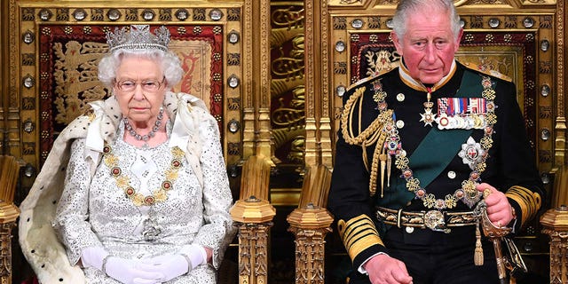 Queen Elizabeth II and Prince Charles in full court dress