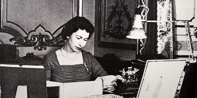 Young Queen Elizabeth II of Great Britain reading despatch papers from her Red Box. Circa 1956. (Photo by: Universal History Archive/Universal Images Group via Getty Images)