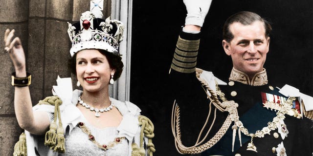 In this colorized print from 1953, Queen Elizabeth II and the Duke of Edinburgh wave to people on the queen's coronation day at Buckingham Palace.