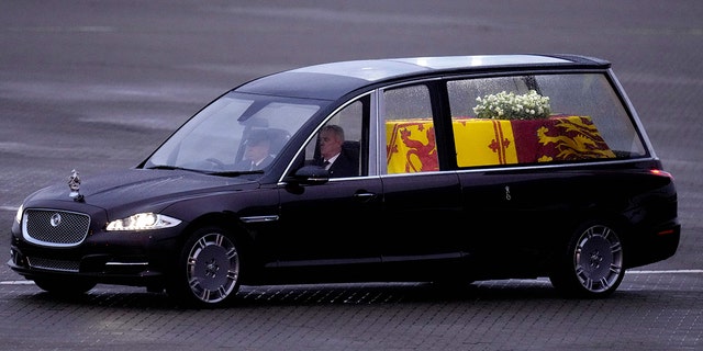 Queen Elizabeth II's coffin traveling to Buckingham Palace.