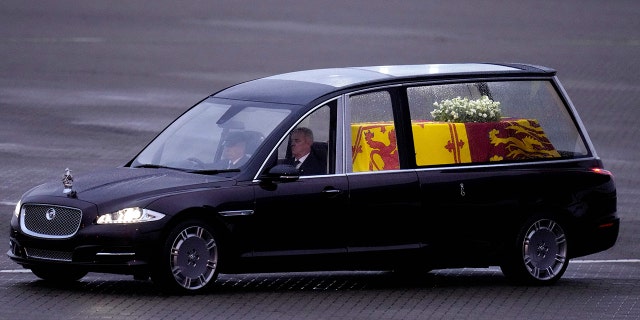 Queen Elizabeth II's coffin traveling to Buckingham Palace.