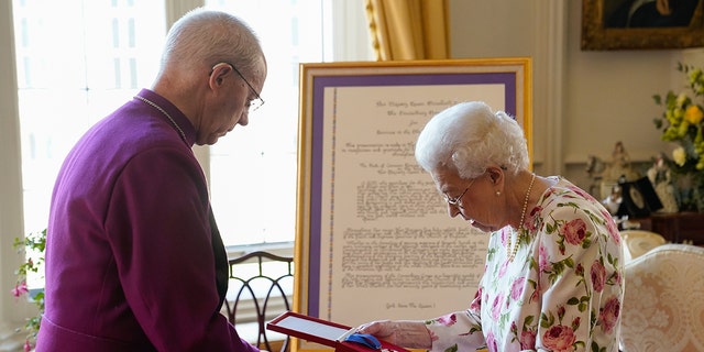Queen Elizabeth II receives Archbishop of Canterbury Justin Welby at Windsor Castle.  He presented her with a special "Canterbury Cross" for her service to the Church of England and a quote for the cross, presented as a framed piece of calligraphy on June 21, 2022.