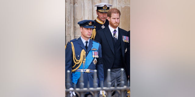 Prince William, Prince of Wales, and Prince Harry, Duke of Sussex, are shown during the state funeral of Queen Elizabeth II at Westminster Abbey.