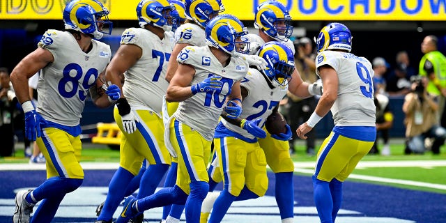 Matthew Stafford (9) of the Los Angeles Rams congratulates Darrell Henderson Jr. (27) after a touchdown during the second quarter against the Atlanta Falcons at SoFi Stadium Sept. 18, 2022, in Inglewood, Calif.