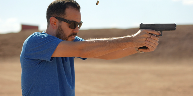 Raul Mendez fires a handgun in video for NRA. 