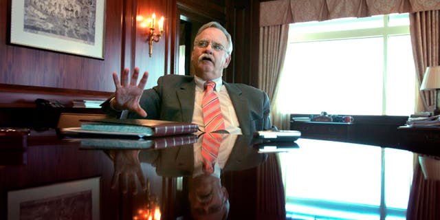 Robert A. Brown, pictured here in his office at Boston University, on April 25, 2006, growed Boston University's endowment from $700 million to $3 billion and become a member of the prestigious Association of American Universities.