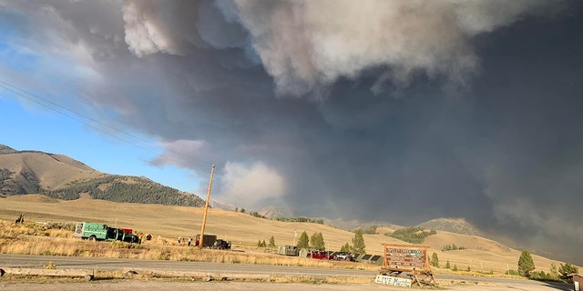 In this photo taken on Sunday, black smoke billows across the sky near the Ross Fork Fire in Idaho.