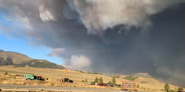 In this photo taken on Sunday, black smoke billows across the sky near the Ross Fork Fire in Idaho.