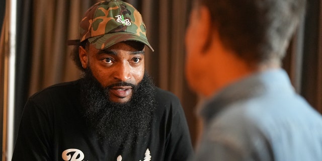 Denzel Jackson of Brewing with Brothas Brewing Company speaks to Samuel Adams founder Jim Koch at the Crafting Dreams Beer Bash in New York City on Sept. 7, 2022.