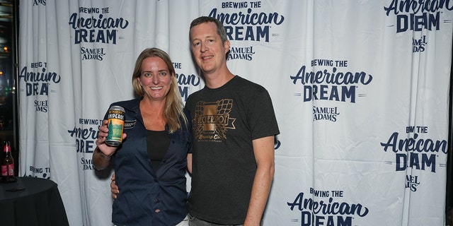 Judy and Rob Neff of Checkerspot Brewing Company pose with their beer at the first annual Samuel Adams Crafting Dreams Beer Bash in New York City on Sept. 7, 2022.