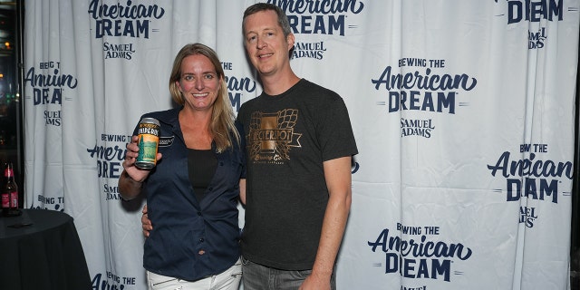 Judy and Rob Neff of Checkerspot Brewing Company pose with their beer at the first annual Samuel Adams Crafting Dreams Beer Bash in New York City on Sept. 7, 2022.