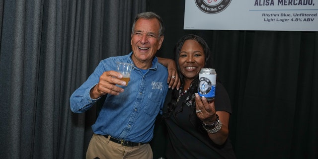Samuel Adams founder Jim Koch and Rhythm Brewing founder Alisa Mercado pose for a photo at the first annual Samuel Adams Crafting Dreams Beer Bash in New York City on Sept. 7, 2022.