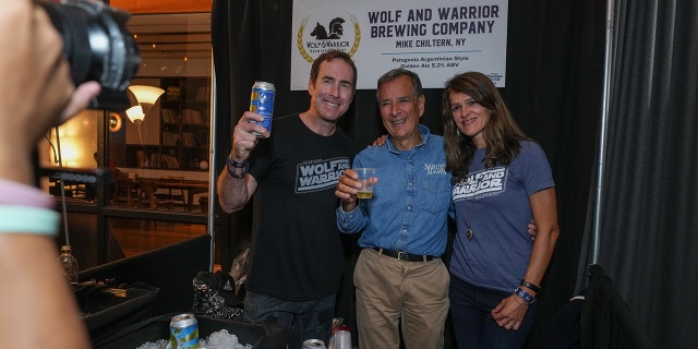Wolf and Warrior Brewing Company co-founders Mike and Jelena Chiltern pose with Samuel Adams founder Jim Koch (center) at the first annual Samuel Adams Crafting Dreams Beer Bash in New York City on Sept. 7, 2022.