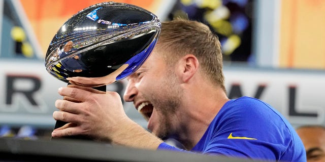 Los Angeles Rams head coach Sean McVay holds up the Lombardi Trophy after the Rams defeated the Cincinnati Bengals 23-20 in the Super Bowl at SoFi Stadium in Inglewood, California on February 13, 2022.