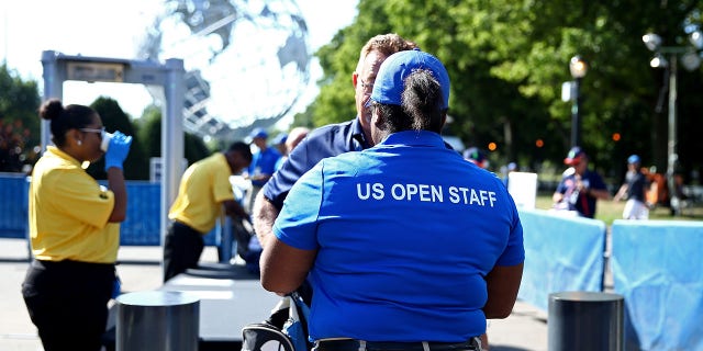 Fans gather outside of security to enter the venue on Day Two of the 2016 US Open at the USTA Billie Jean King National Tennis Center on August 30, 2016, in the Flushing neighborhood of the Queens borough of New York City.