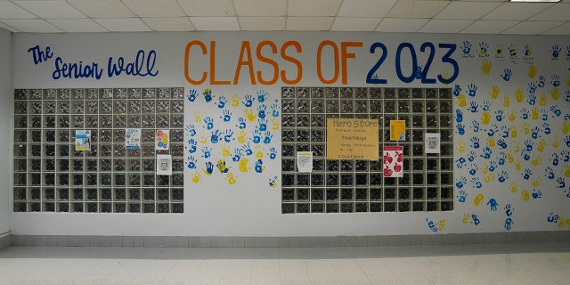 A school hallway is decorated with student handprints before Hurricane Ian landed in Florida.