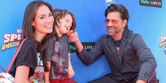 John Stamos and his family of three enjoyed a Spider-Man-themed event at th...