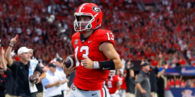 Stetson Bennett #13 of the Georgia Bulldogs rushes in for a touchdown during the first half against the Oregon Ducks at Mercedes-Benz Stadium on September 3, 2022 in Atlanta, Georgia.