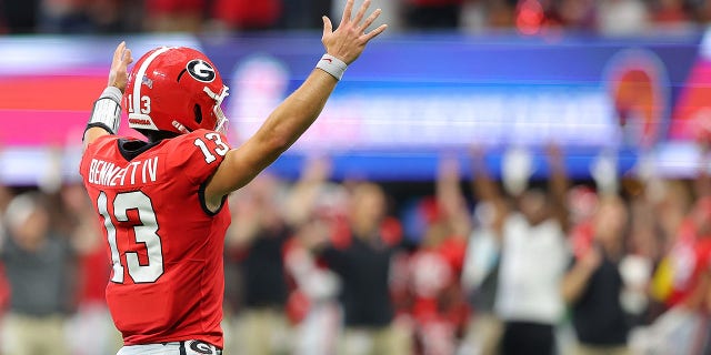 Stetson Bennett #13 of the Georgia Bulldogs reacts after their first touchdown against the Oregon Ducks during the first quarter of the Chick-fil-A Kick-Off Game between Oregon and Georgia at Mercedes-Benz Stadium on September 03, 2022 in Atlanta, Georgia.
