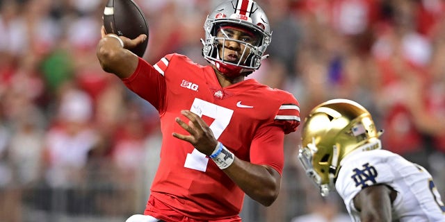 Ohio State quarterback CJ Stroud throws under pressure from Notre Dame safety DJ Brown during the second quarter of an NCAA college football game in Columbus, Ohio, Sept. 3, 2022.