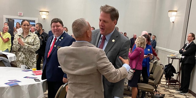 The hug between Bolduc and Sununu appeared to be an attempt to erase a recent history of bad blood between the two men.