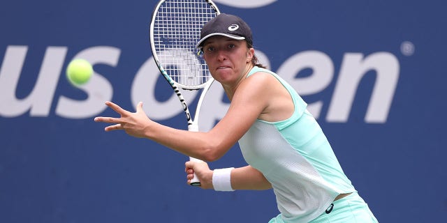 Iga Swiatek of Poland returns a shot against Jule Niemeier of Germany during their Women’s Singles Fourth Round match on Day Eight of the 2022 US Open at USTA Billie Jean King National Tennis Center on September 05, 2022 in the Flushing neighborhood of the Queens borough of New York City.