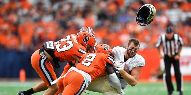 Purdue University on Saturday, Sept. 17, when he was tackled by Syracuse linebacker Marlowe Wax, 2, and defensive back Justin Barron, 23, in the first half of an NCAA college football game in Syracuse, N.Y. tight end Payne Durham (right) lost his helmet.  , 2022.
