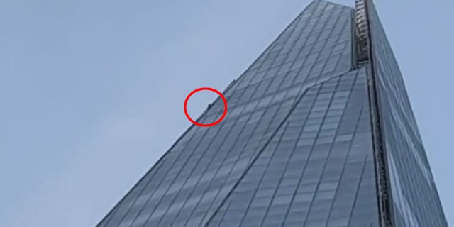 The climber was spotted on the 1,016-foot skyscraper in London early Sunday.