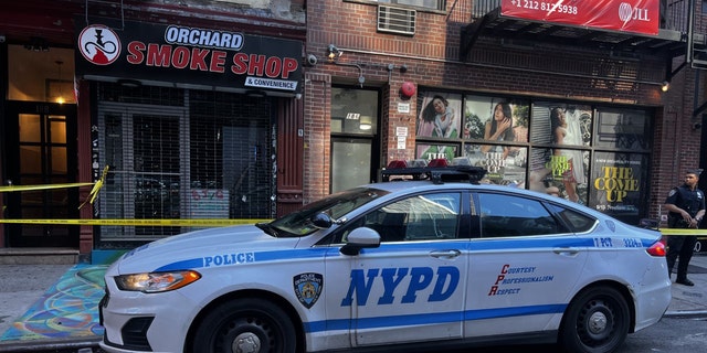 An NYPD vehicle at the scene of a Lower East Side smoke shop shooting. 