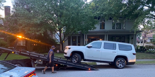 An SUV was towed Friday night from the front of the home of the Tennessee woman abducted on her jog.