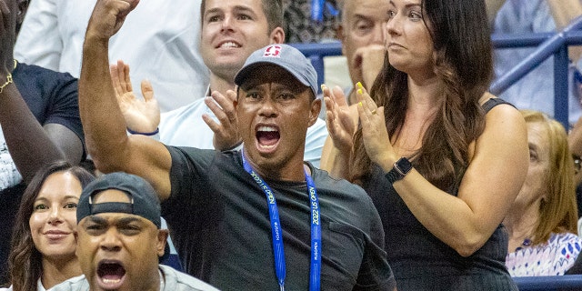 Golf legend Tiger Woods delivered a fist pump to cheer on tennis star Williams. 