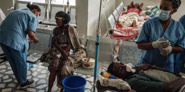 Ethiopians receive medical attention at a hospital in Mekele, Ethiopia, on June 24, 2021, after an airstrike on a market in the Tigray region. The conflict is still raging to this day.