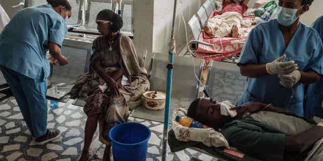 Ethiopians receive medical attention at a hospital in Mekele, Ethiopia, on June 24, 2021, after an airstrike on a market in the Tigray region. The conflict is still raging to this day.