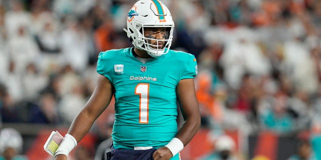 Miami Dolphins quarterback Tua Tagovailoa looks to the sidelines during the first half of an NFL football game against the Cincinnati Bengals, Thursday, Sept. 29, 2022, in Cincinnati. Tagovailoa suffered a second frightening injury in five days when he was carted off the field Thursday.