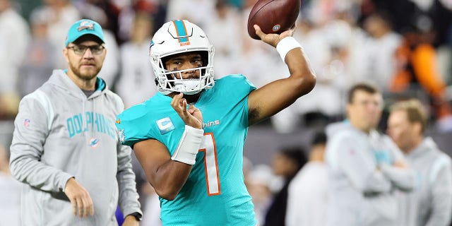 Quarterback Tua Tagovailoa of the Miami Dolphins warms up before a game against the Cincinnati Bengals at Paycor Stadium Sept. 29, 2022, in Cincinnati.