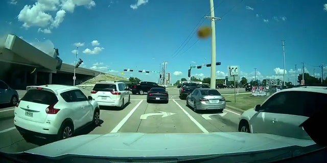Screenshot of a Texas driver's captured video of an 18-wheeler flying off a freeway overpass before bursting into flames.