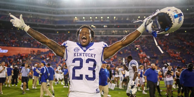 Andru Phillips #23 of the Kentucky Wildcats celebrates after defeating the Florida Gators 26-16 in a game at Ben Hill Griffin Stadium on September 10, 2022 in Gainesville, Florida.