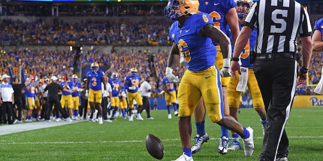 Rodney Hammond Jr. #6 of the Pittsburgh Panthers celebrates after rushing for a 6-yard touchdown in the second quarter during the game against the West Virginia Mountaineers at Acrisure Stadium on September 1, 2022 in Pittsburgh, Pennsylvania.
