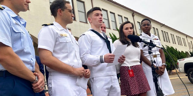 Navy sailor Ryan Sawyer Mays, center, reads a statement after his acquittal on Friday in San Diego. A Navy judge has ruled Mays was not guilty of setting a fire that destroyed the USS Bonhomme Richard in San Diego in 2020.