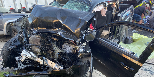 The wreckage of a Toyota Tacoma. The driver was smuggling nine illegals when she blew past red lights and crashed into a semi. The driver and one more were pronounced dead at the scene.  