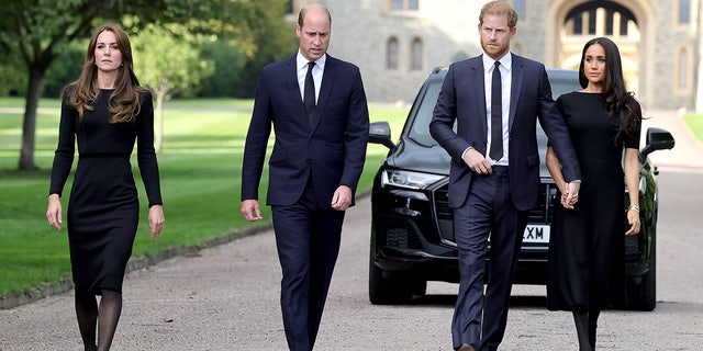 Kate Middleton and Prince William were far less affectionate with each other while greeting the crowds outside Windsor Castle than Harry and Meghan, according to a body language expert.