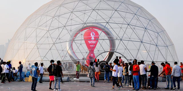 People visit the 100-day countdown clock for the Qatar 2022 FIFA World Cup finals in Doha, Qatar, Aug. 12, 2022.