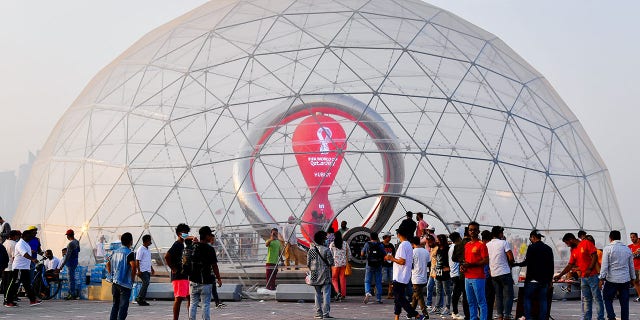 People visit the 100-day countdown clock for the Qatar 2022 FIFA World Cup finals in Doha, Qatar, Aug. 12, 2022.