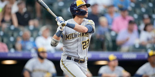 Milwaukee Brewers' Christian Yelich follows the flight of his solo home run into the third deck off Colorado Rockies starting pitcher Chad Kuhl in the first inning of a baseball game Tuesday, Sept. 6, 2022, in Denver.