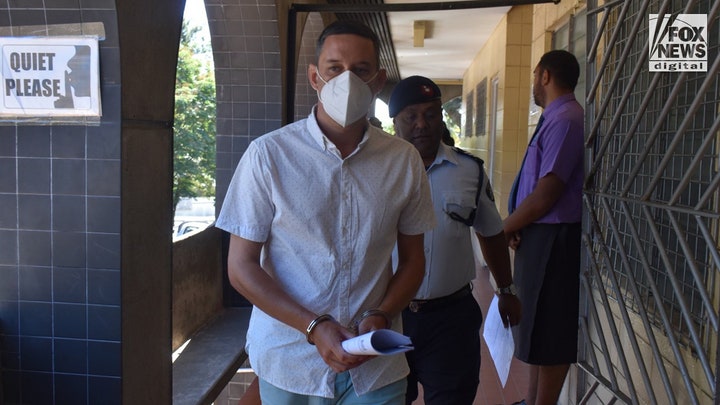 Bradley Dawson escorted to the cell block at the High Court in Lautoka, Fiji